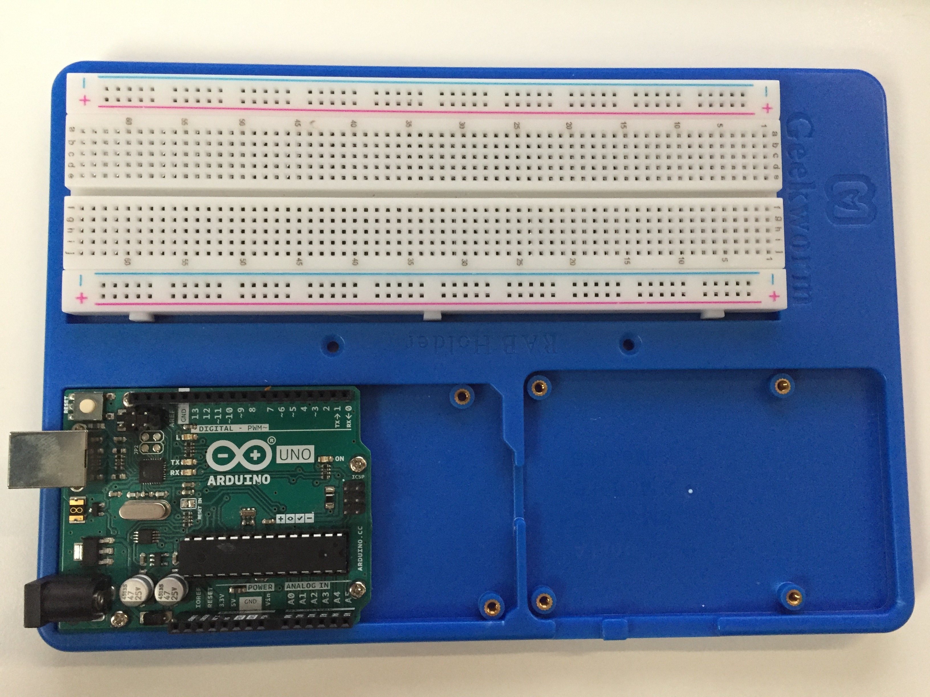 Arduino and breadboard in holder